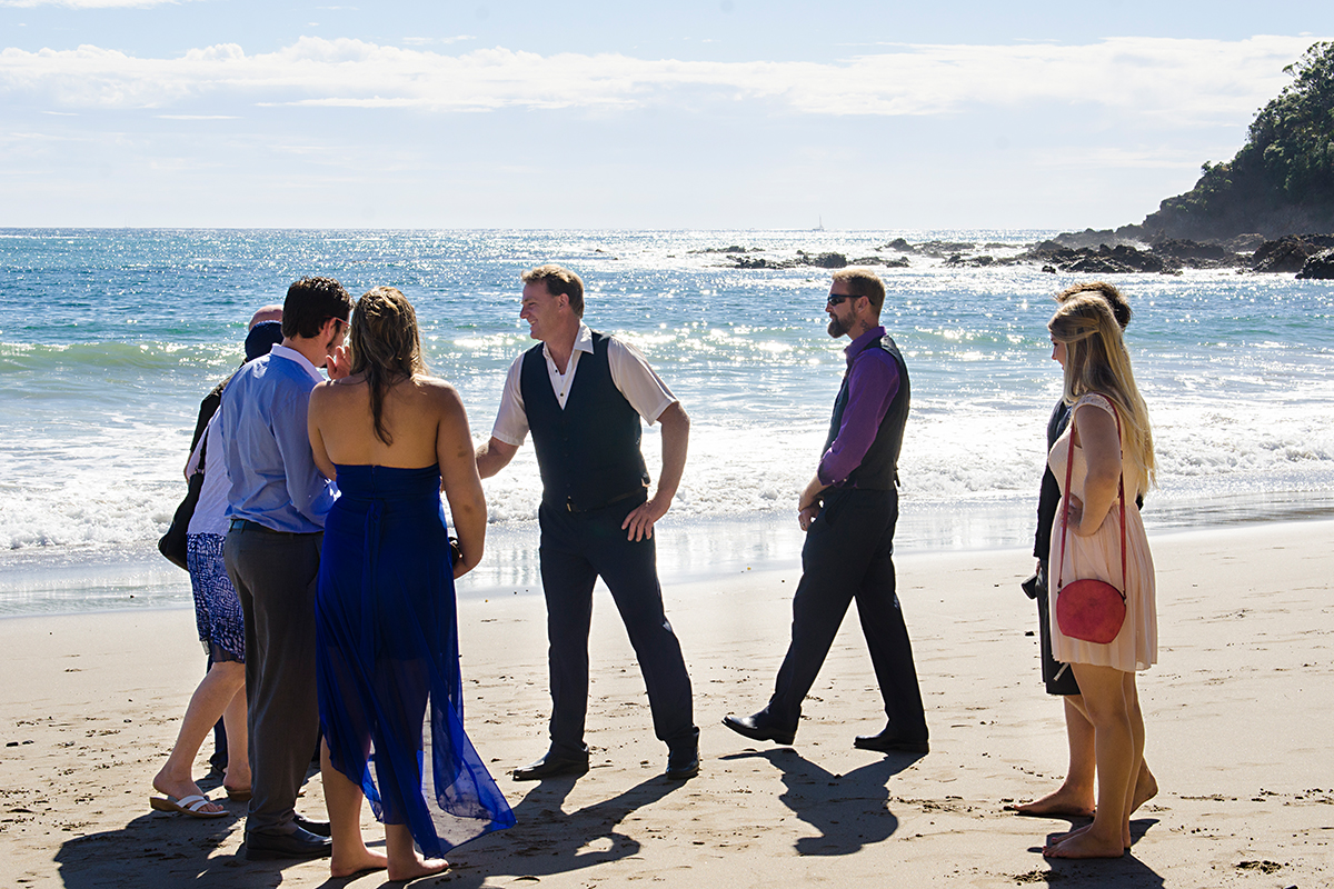 groom greeting guests beach wedding northland nz